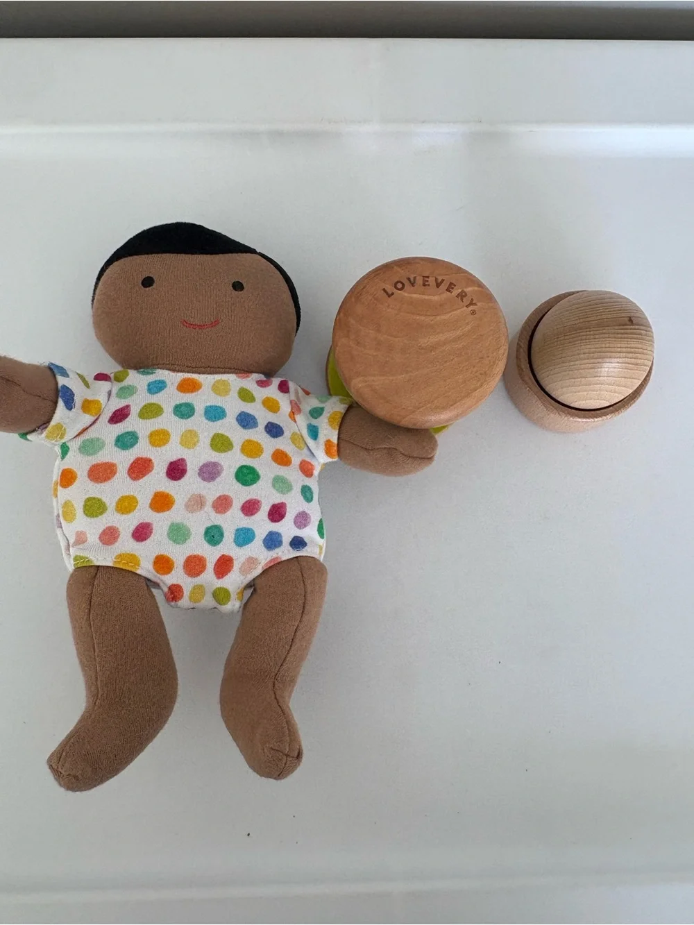 Lovevery montessori baby toy bundle of baby doll, egg and cup, and rolling bell